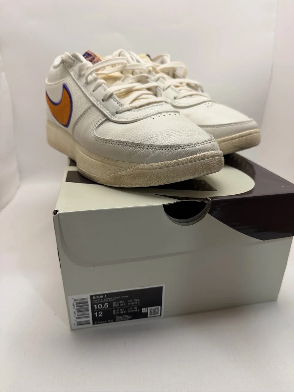 Nike mens Book 1 Sneakers Sail/Clay Orange and Purple